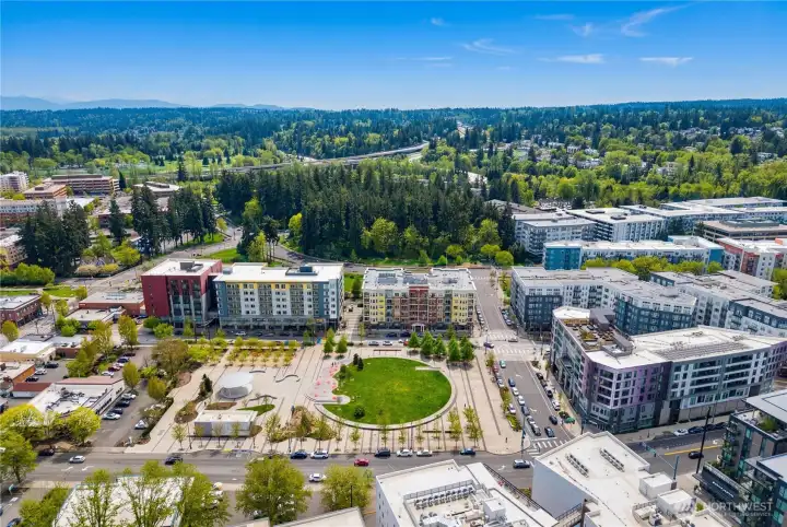 Elevated, eagle-eye view of The Cleveland, showcasing its stately presence and park-side setting in the heart of Downtown Redmond