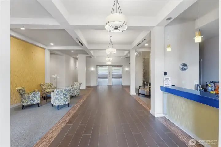 Inviting lobby entry with a clear view to the double elevators, offering easy access to every floor