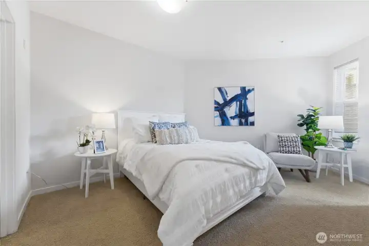 Bright, well-appointed bedroom with soft natural light and a calm, modern design