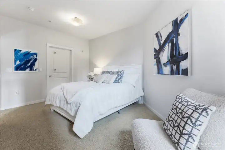 Bright bedroom with an adjoining door leading conveniently into the bathroom