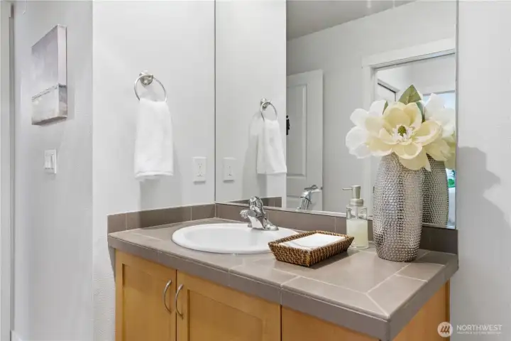 Bright vanity area with modern finishes and simple, elegant décor
