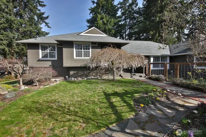 Let's go inside. You have walked alongside the garage to the south side. Tastefully landscaped with a fenced garden area. Let's go inside. You have walked alongside the garage to the south side. Tastefully landscaped with a fenced garden area.
