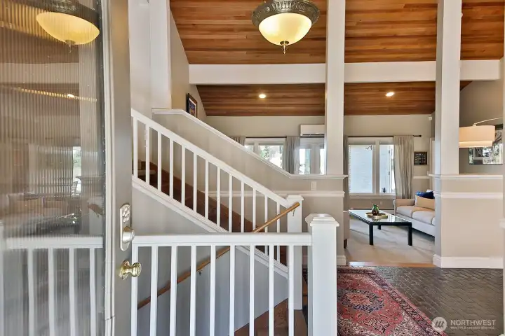 Main level entry has space to take your shoes off (please do). Stairs down lead to the apartment. Stairs up lead to the Primary Suite, 2 add'l bedrooms, a 2nd full bath, and walk up attic. To the right is Dining Room & Kitchen. Main level entry has space to take your shoes off (please do). Stairs down lead to the apartment. Stairs up lead to the Primary Suite, 2 add'l bedrooms, a 2nd full bath, and walk up attic. To the right is Dining Room & Kitchen.