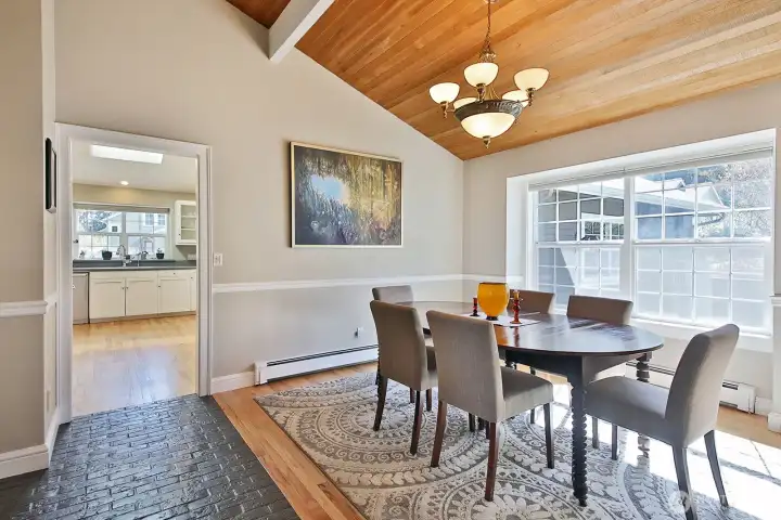 A favorite spot to take in the sunshine, the Dining Room provides additional space to entertain or enjoy an afternoon cup of tea. Let's go check out the Kitchen. Your back is to the stairs leading to the upper and lower levels. A favorite spot to take in the sunshine, the Dining Room provides additional space to entertain or enjoy an afternoon cup of tea. Let's go check out the Kitchen. Your back is to the stairs leading to the upper and lower levels.