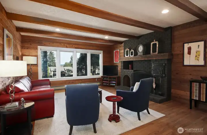 The wood paneling in the family room is wormwood and provides a unique rustic charm and an inviting warmth. This is the wonderful space to cozy up by the fire. Let's go check out the bedrooms..... The wood paneling in the family room is wormwood and provides a unique rustic charm and an inviting warmth. This is the wonderful space to cozy up by the fire. Let's go check out the bedrooms.....