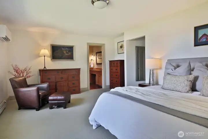 Open door in the center of the photo is the bathroom. Walk in closet is located between the bedroom and the hallway. Open door in the center of the photo is the bathroom. Walk in closet is located between the bedroom and the hallway.