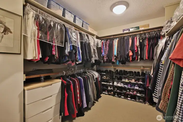 Spacious Primary walk-in closet with enough space for a dresser/armoir. Spacious Primary walk-in closet with enough space for a dresser/armoir.