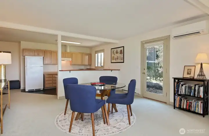 Glass door provides separate entrance to the lower level apartment. Note a mini-split. Your back is to the third living room space in this home, to another bedroom (#4) AND an additional room/office. Glass door provides separate entrance to the lower level apartment. Note a mini-split. Your back is to the third living room space in this home, to another bedroom (#4) AND an additional room/office.