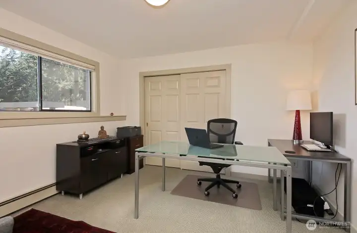 Lower level bedroom, currently living as an office, has a standard sized closet. Lower level bedroom, currently living as an office, has a standard sized closet.