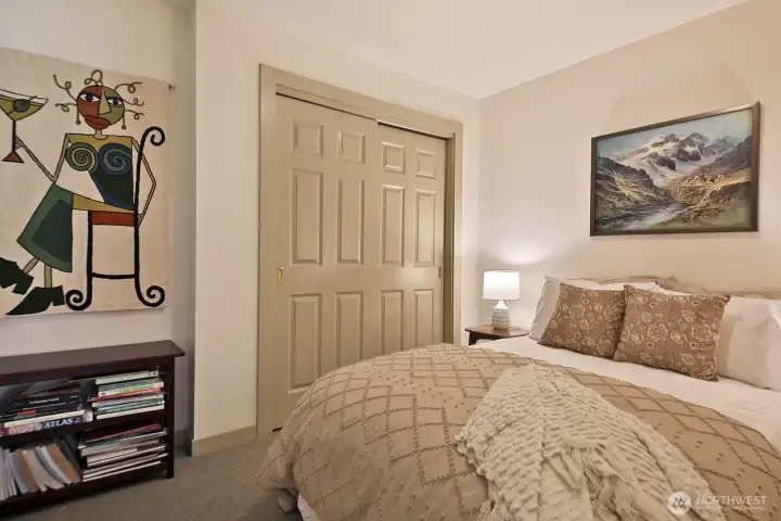 This room, staged as a guest room, is another versatile space in the home. The closet in the photo houses the hot water heater and access to the crawlspace. There is another, standard size closet beyond the right edge of the photo. There is no window in this room. This room, staged as a guest room, is another versatile space in the home. The closet in the photo houses the hot water heater and access to the crawlspace. There is another, standard size closet beyond the right edge of the photo. There is no window in this room.