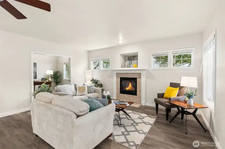 The comfortable living room portion of the great room flows into a large den and enjoys a cozy, gas fireplace, art recess, and high transom windows offering both light and privacy, along with wall space for your big screen or collections. The comfortable living room portion of the great room flows into a large den and enjoys a cozy, gas fireplace, art recess, and high transom windows offering both light and privacy, along with wall space for your big screen or collections.