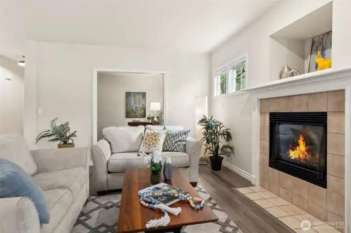 The warm laminate wood-style flooring in driftwood tones, handsome painted wood millwork and neutral finishes welcome many styles and arrangements. The large den beyond can also house a media space. The warm laminate wood-style flooring in driftwood tones, handsome painted wood millwork and neutral finishes welcome many styles and arrangements. The large den beyond can also house a media space.