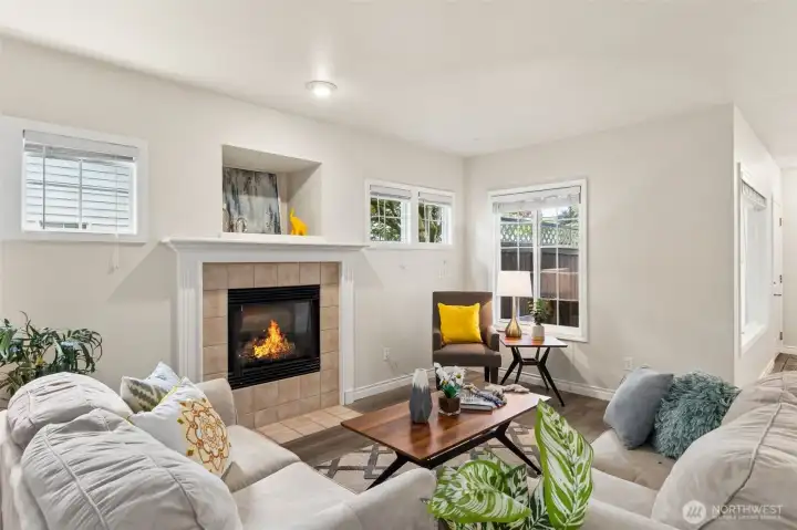 A view of the living space from the den reveals a large grided window to view the patio space, bringing light and space to this comfortable floor plan. A view of the living space from the den reveals a large grided window to view the patio space, bringing light and space to this comfortable floor plan.