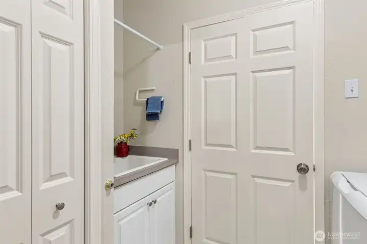 The utility/mud room offers passage to the garage and a convenient utility sink for cleaning up fido, potting plants or soaking delicates. Large storage closet for coats, boots and extras too! The utility/mud room offers passage to the garage and a convenient utility sink for cleaning up fido, potting plants or soaking delicates. Large storage closet for coats, boots and extras too!