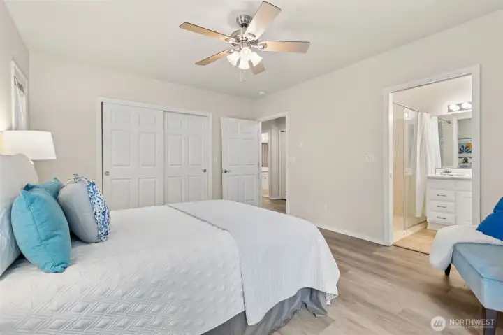 A second view of the primary suite shows the wide door to the bathroom, and the upgrades, low-threshold shower A second view of the primary suite shows the wide door to the bathroom, and the upgrades, low-threshold shower