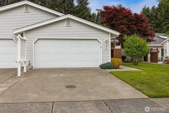 The large, two car garage, and two car driveway offer a hard-to-find extra and is ready for vehicles, bikes, outdoor gear or your workshop. The home is duplex style but feels very much like a single family home. The large, two car garage, and two car driveway offer a hard-to-find extra and is ready for vehicles, bikes, outdoor gear or your workshop. The home is duplex style but feels very much like a single family home.