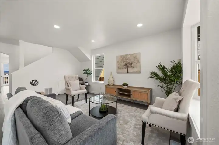 Light-filled living space with classic bay windows, new flooring, and fresh paint offers a bright and refreshed feel throughout.