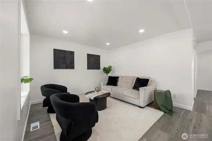 Stylish additional living area with modern finishes and an open feel provides the perfect spot for lounging or gathering.