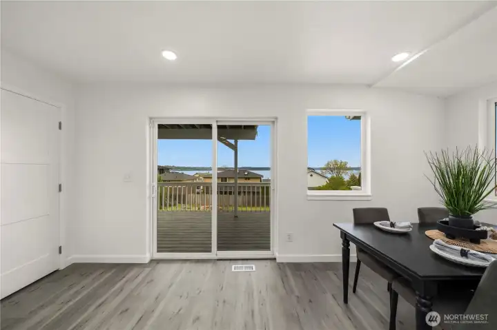 Convenient deck access just off the kitchen and dining area makes outdoor dining and summer entertaining effortless.