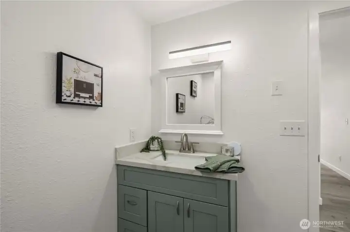 Tastefully updated upstairs bath showcasing contemporary finishes and thoughtful design details.