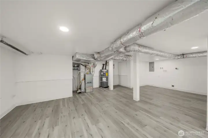 Versatile finished basement houses the laundry area while providing flexible space for a home gym, office, or bonus room.