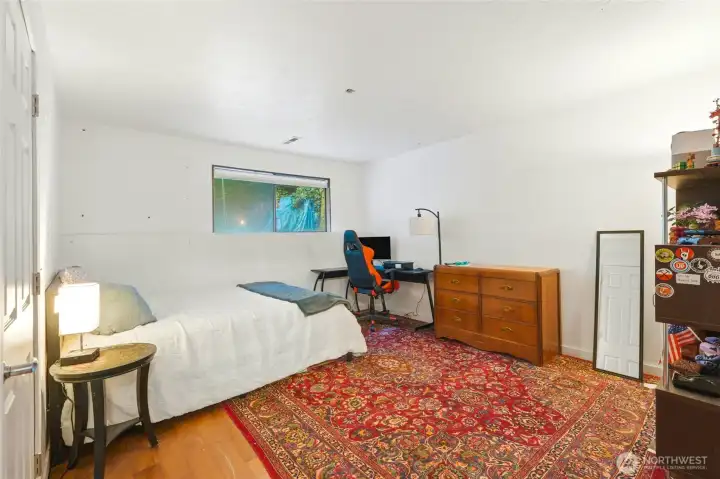 Downstairs family room currently used as bedroom