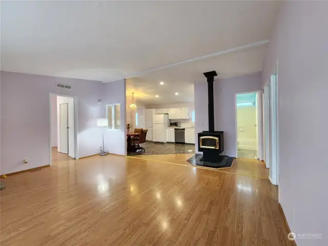 Wide angle view of the living room with wood stove