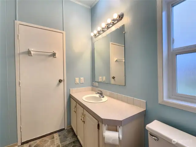 Primary bathroom. It is very light and has a window that opens
