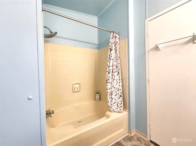 Oversized primary bathroom tub / shower. New faucets and a large shower head for long relaxing showers