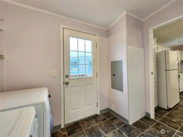 View of the laundry room looking into the kitchen and out to the back proch