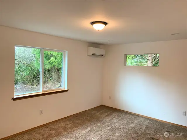 No carpet in primary bedroom. Same laminated hardwood as living room