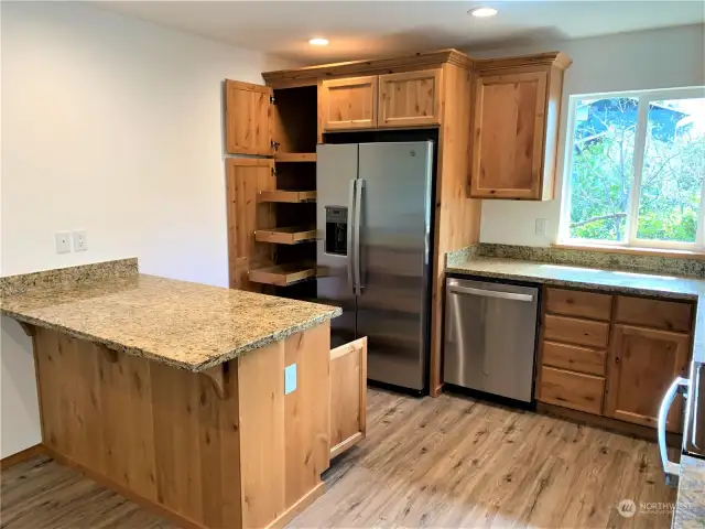 Pull out shelving on Island and pantry to left of refrigerator