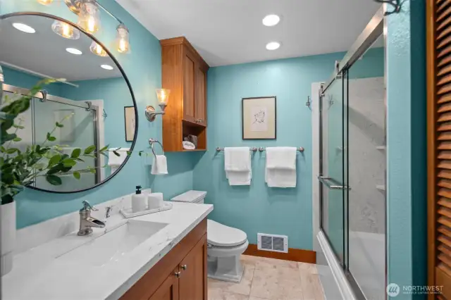 This stunning, fully remodeled spa-like bathroom brings a refreshing touch of lake life into every detail.