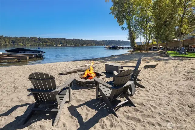 Summer nights never lose their magic on the shores of Lake Sammamish, with breathtaking sunsets, the warm glow of a crackling fire pit, a glassy lake, and eagles soaring high above.