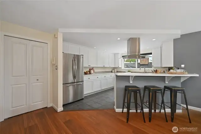 Dining has room for a table and counter stools.