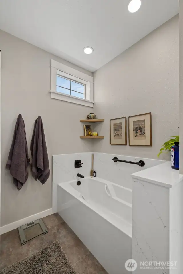 Soaking tub in the primary bathroom.