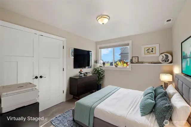 Lower level guest room virtually staged.
