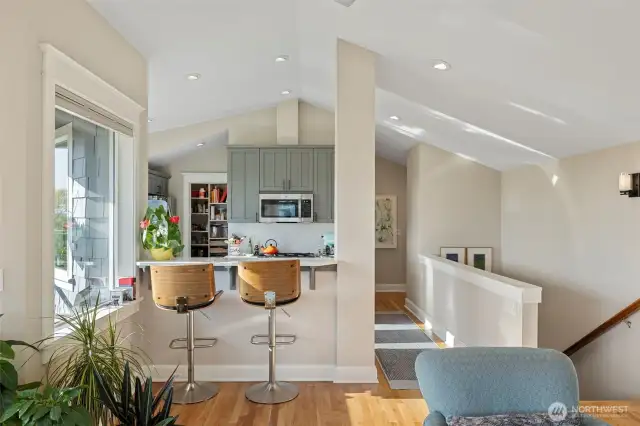 Vaulted ceilings carries throughout the upper level.