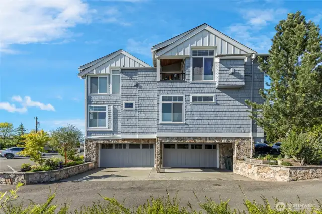 Unit on the left with 2 car garage underneath.