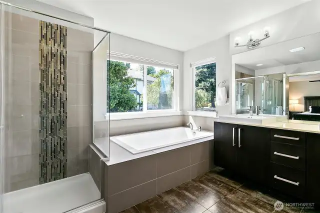 Walk in shower and soaking tub with double vanities.
