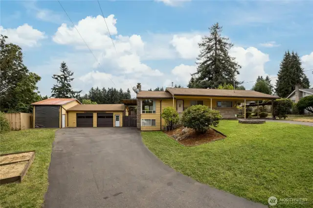 Welcome to this rambler with daylight basement and huge shop!