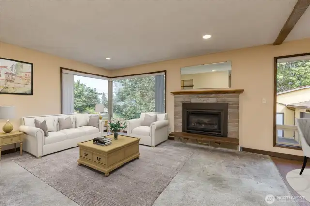 Cozy gas fireplace with stonework surround