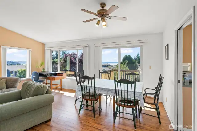 Living Room Opens to Dining Area with Deck Access