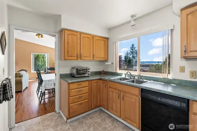Kitchen Off Dining Area Soaks in Water Views
