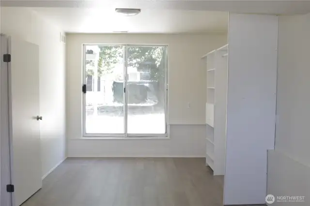 Bedroom 3 with slider to the backyard.