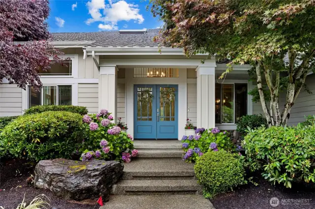 Tucked away from the street with ultimate privacy, this home welcomes you with a warm and welcoming entry and a hidden garage for sleek curb appeal.
