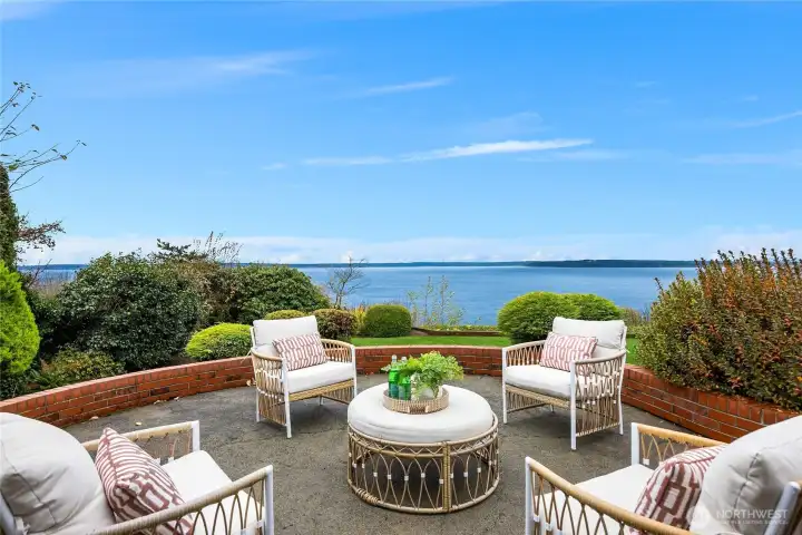 Large patio with enough room for 3 seating groups including an outdoor dining table.  Great views & total privacy!