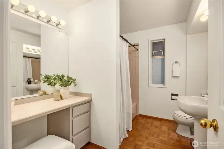Full bathroom serves the second bedroom on the main floor.