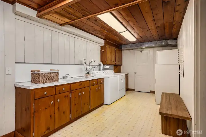 The laundry room is in the lower level.  Lots of storage cabinetry and a sink.