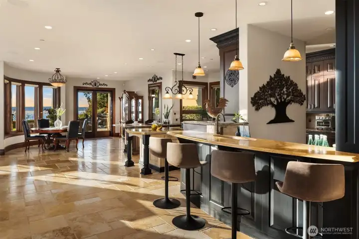 The inviting bar area has a Terrazzo countertop highlighted by handsome pendant lighting.